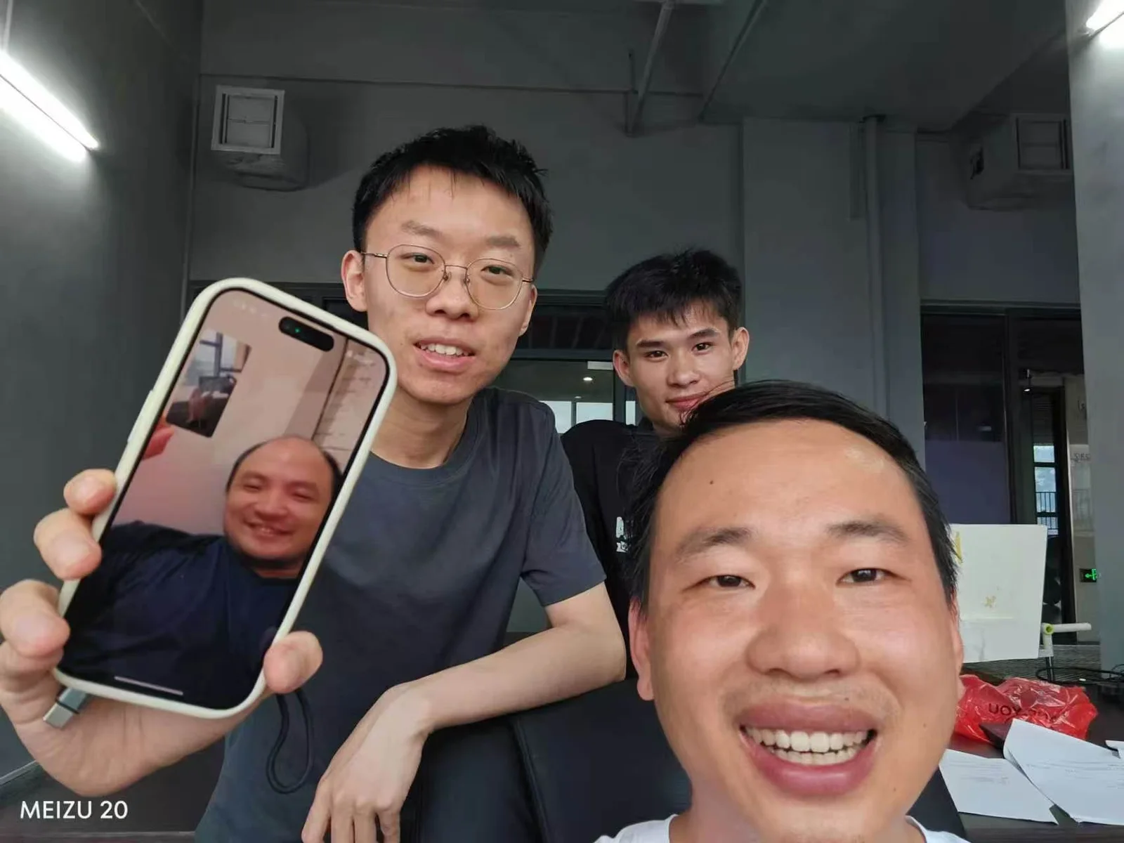 An early TOOLAZO team moment during the company move, with Qingheng Wu joining from the United States by video call